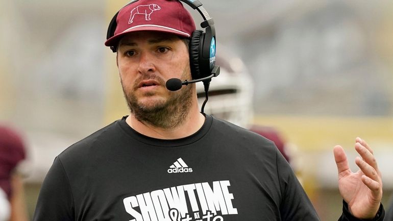 Mississippi State head coach Jeff Lebby calls to his players...