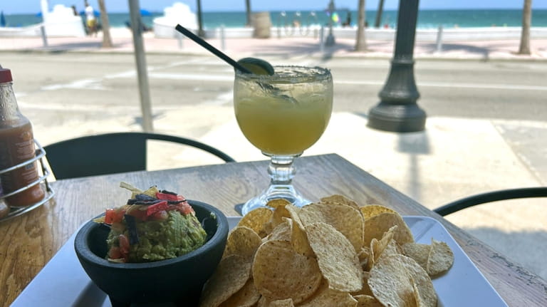 A margarita, chips and guacamole at The Drunken Taco across...
