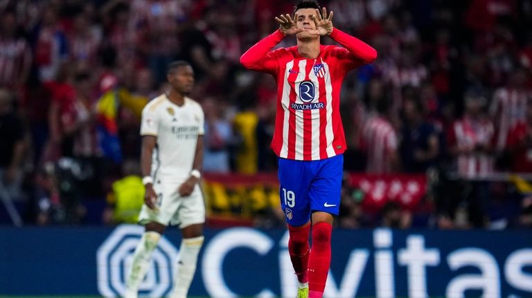 Atletico Madrid's Alvaro Morata celebrates after scoring his side's third...