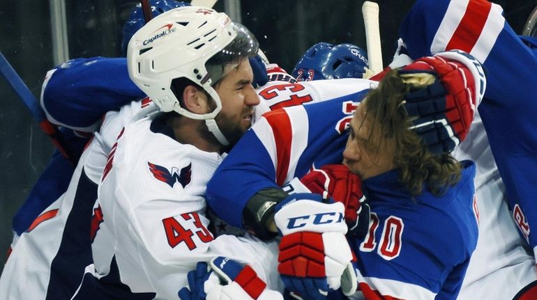 Tom Wilson of the Capitals takes a roughing penalty during...