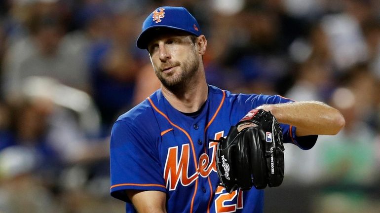 Max Scherze of the Mets looks on an inning against the Nationals...