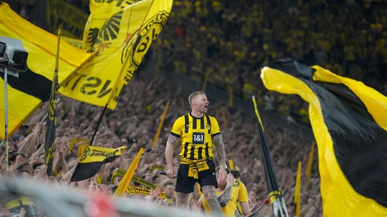 Dortmund's fans cheer for their team during the Champions League...