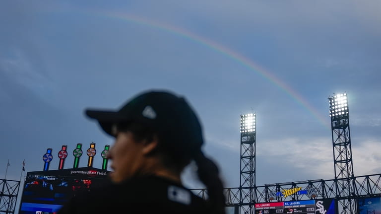 A rainbow appears beyond Guaranteed Rate Field during a rain...