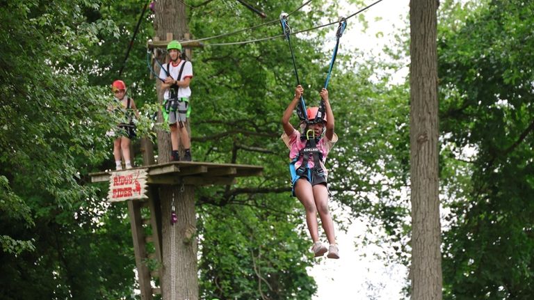 Genevive Philogene's first ride on the zip line at Coleman...