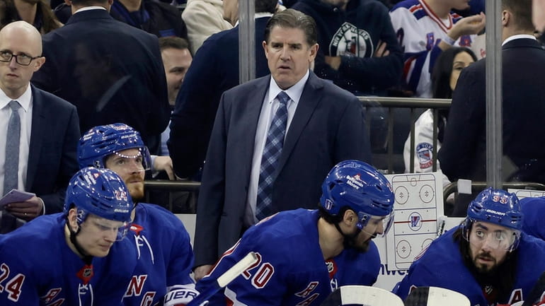 Head coach Peter Laviolette of the Rangers looks on against the...