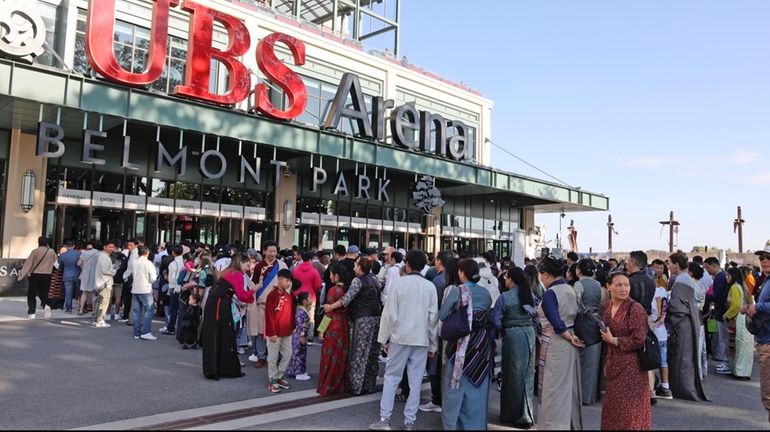 A large crowd gathers Thursday to see the Dalai Lama at...