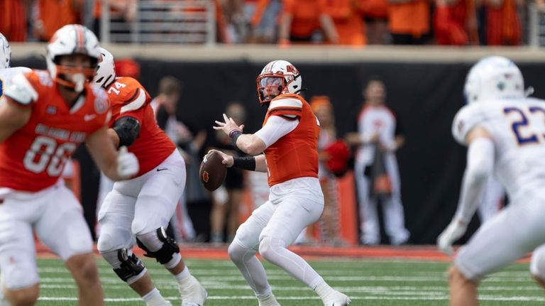 Oklahoma State quarterback Alan Bowman (7) throws a touchdown in...