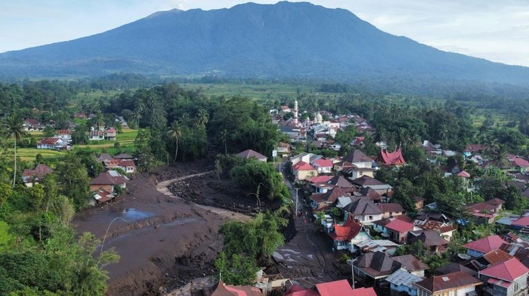 This drone photo shows the damage at a village affected...