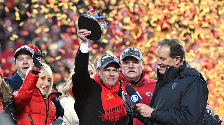 Norma Hunt, left, and her son Clark Hunt, center, owners...