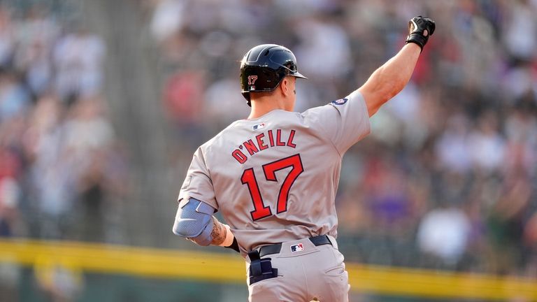 Boston Red Sox's Tyler O'Neill gestures to the bullpen as...