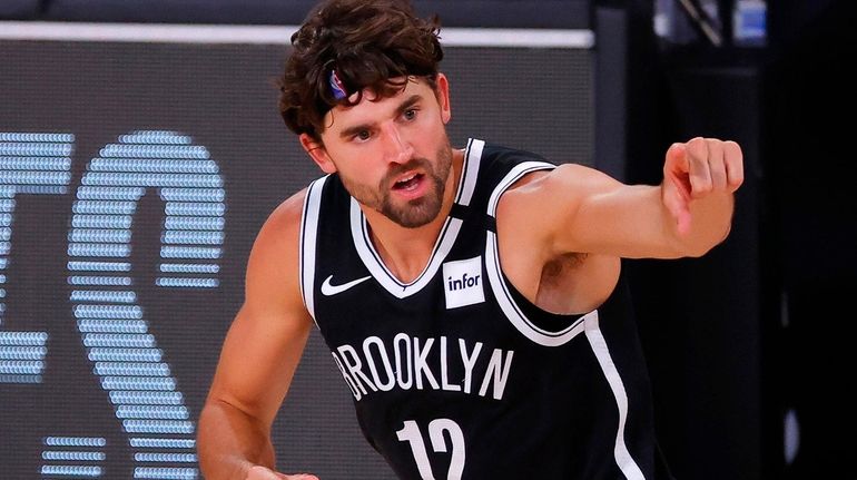 Joe Harris of the Brooklyn Nets reacts after hitting a...