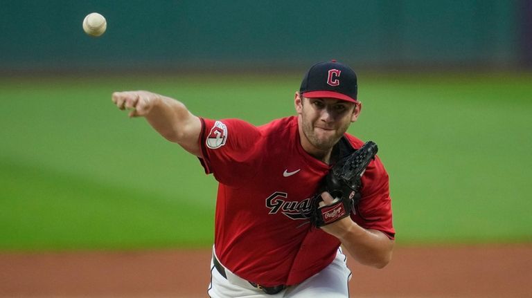 Cleveland Guardians' Gavin Williams pitches in the first inning of...