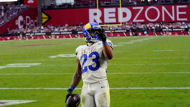 Los Angeles Rams running back Kyren Williams celebrates after scoring...