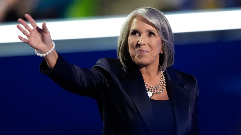 New Mexico Gov. Michelle Lujan Grisham waves during the Democratic...