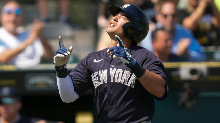 Yankees prospect Anthony Volpe reacts after hitting a leadoff solo home...