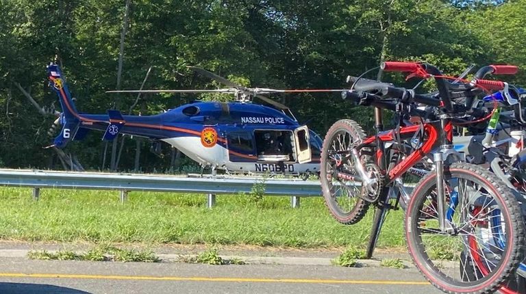 A Nassau police helicopter lands on the Southern State Parkway...