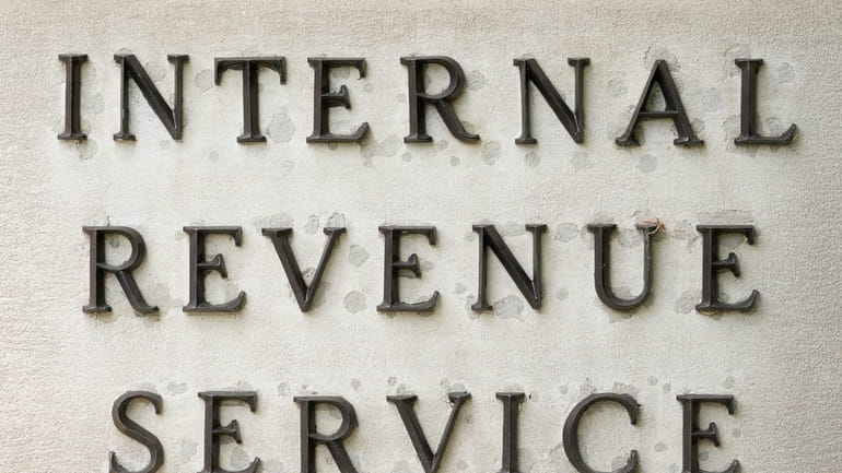 A sign for the Internal Revenue Service is shown on...