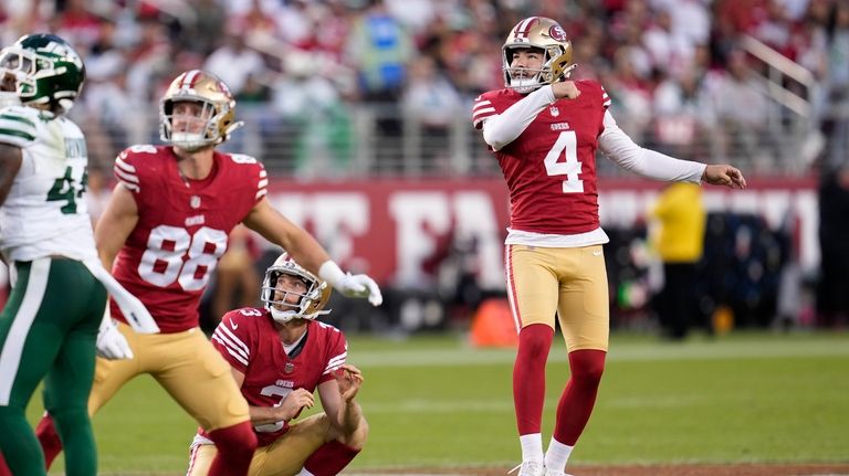 San Francisco 49ers place-kicker Jake Moody (4) watches his field...