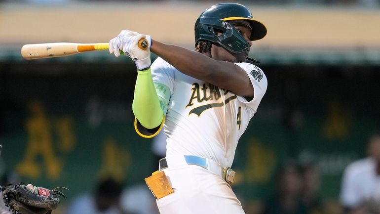 Oakland Athletics' Lawrence Butler hits an RBI double against the...