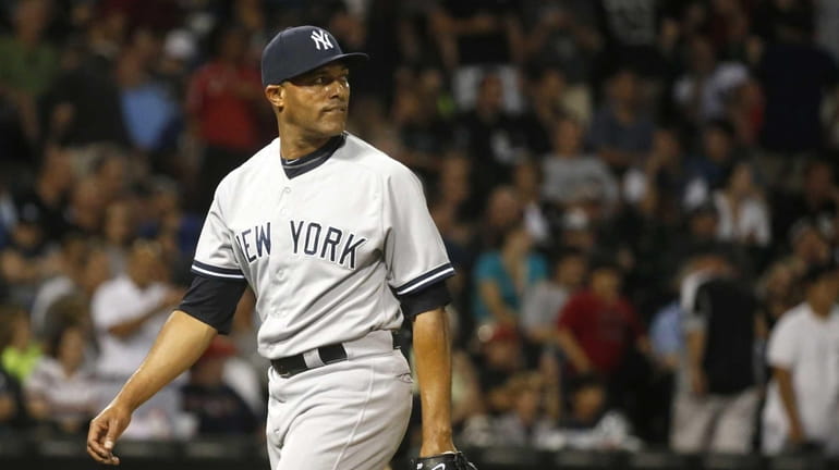 Yankees closer Mariano Rivera looks at the scoreboard after the...