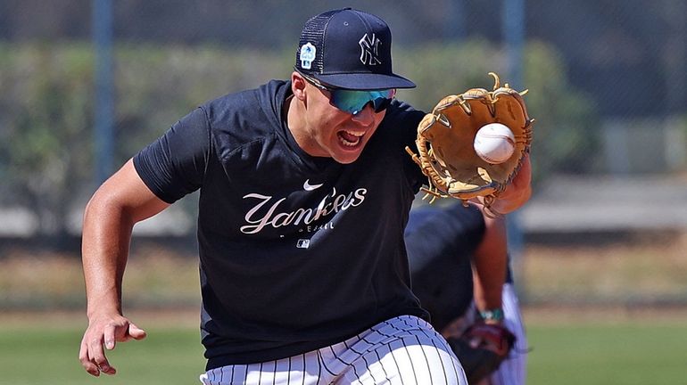 Yankees shortstop Anthony Volpe does fielding drills during spring training...