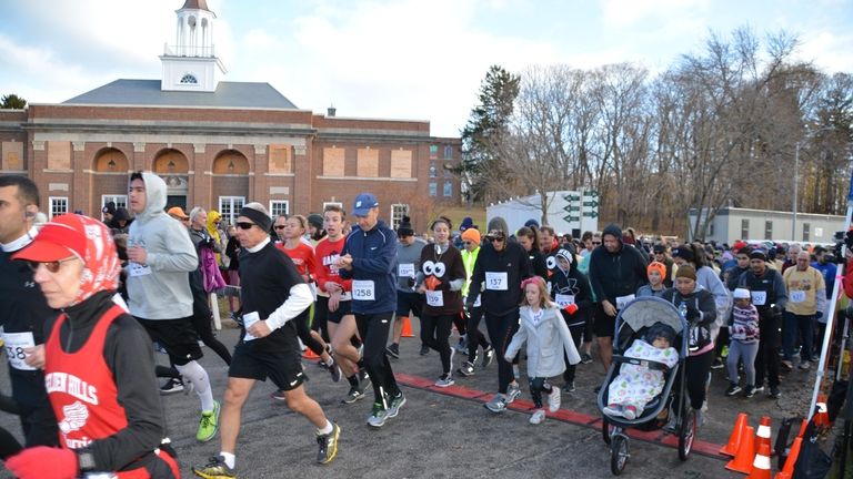 Runners, walkers, joggers and other participants take part in the...