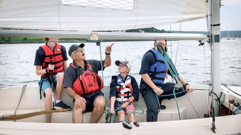 From left, Sea Scout A.J. Valenti, Sea Scout leader Masaki...