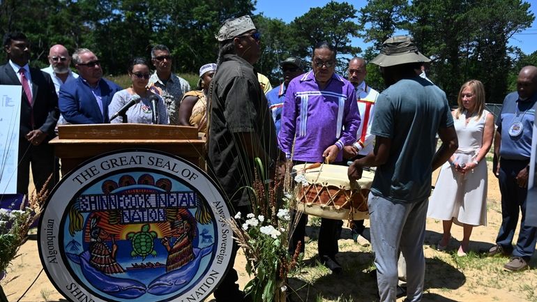 Members of the Shinnecock Indian Nation prepare for the groundbreaking...