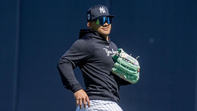 Yankees outfielder Jasson Dominguez takes fly balls during spring training at...