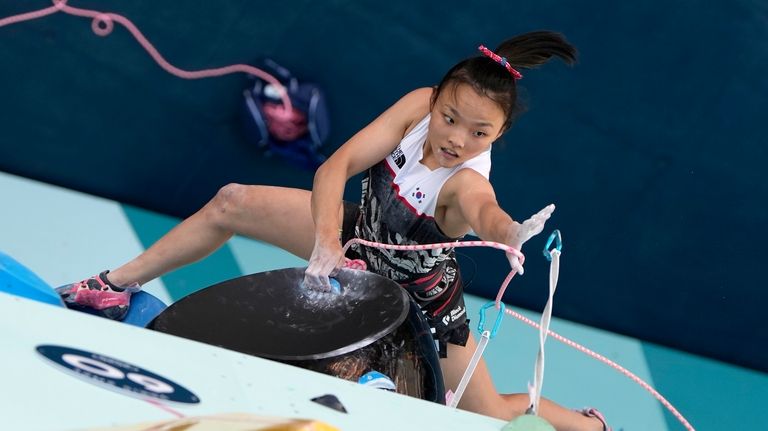 Seo Chaehyun of South Korea competes in the women's boulder...