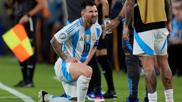 Argentina's Lionel Messi grimaces during a Copa America Group A...