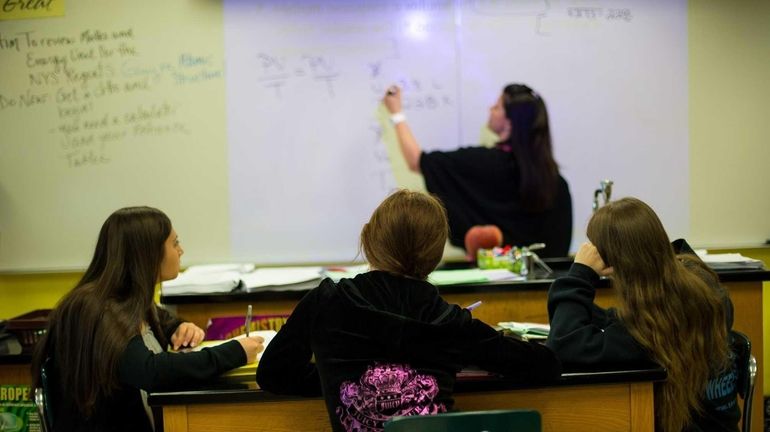 A class of 11th grade regent chemistry students at Island...