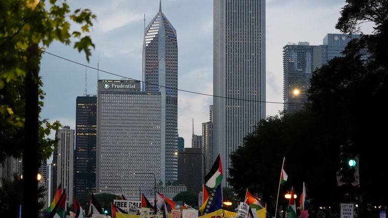 Protesters march prior to the start of the Democratic National...