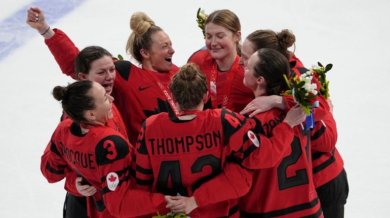 Canada celebrates their gold medal after defeating the United States...