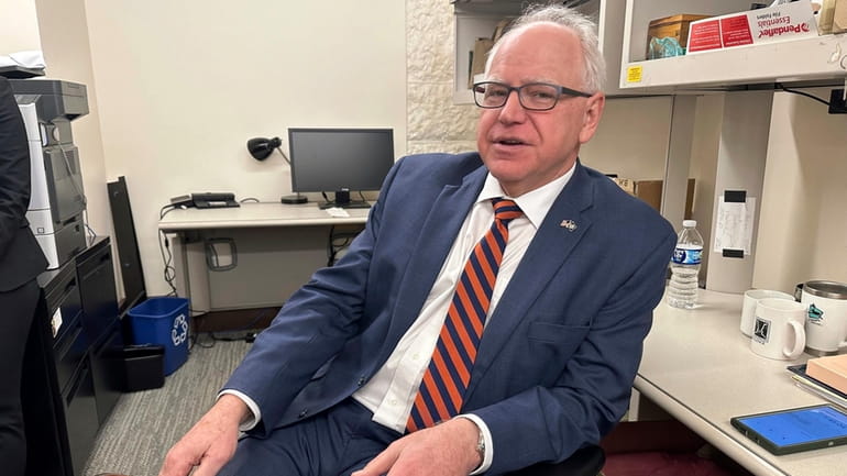 Gov. Tim Walz is photographed in the press room at...