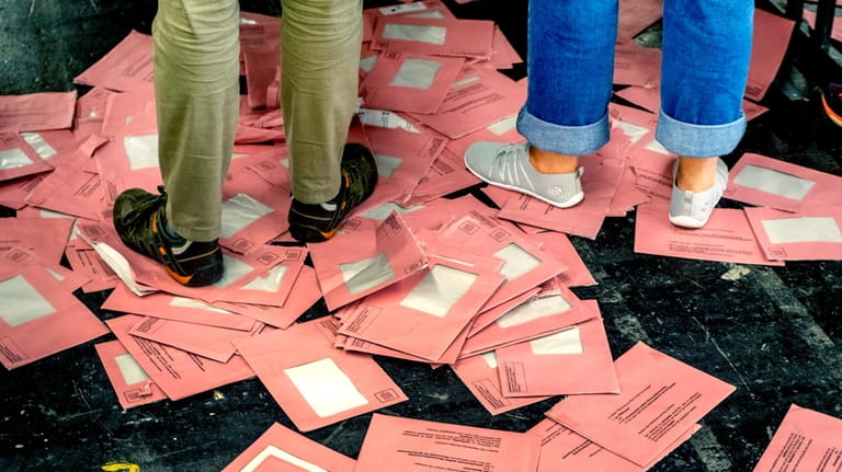 Empty envelopes of postal ballots for the European elections lie...
