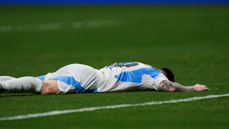 Argentina's Lionel Messi reacts after missing a chance to score...