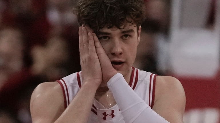 Wisconsin's Max Klesmit reacts after his three pointer during the...