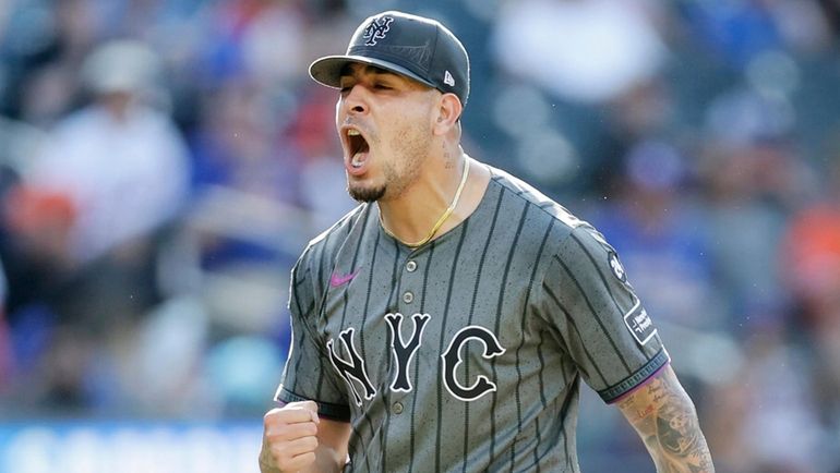 Jose Butto of the Mets reacts after an inning against the Colorado...