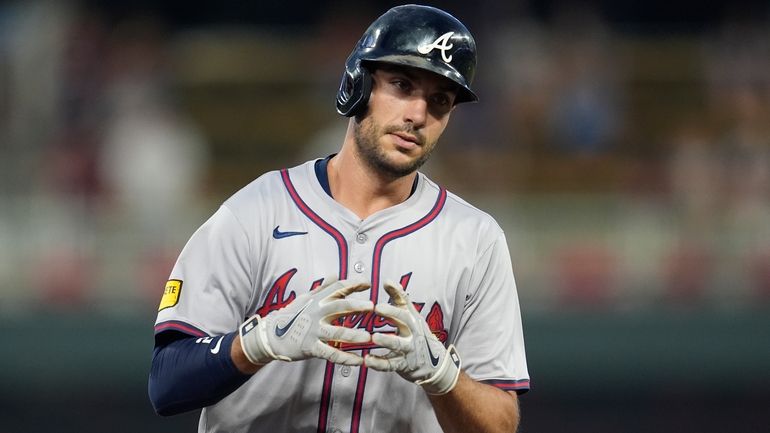 Atlanta Braves' Matt Olson celebrates while running the bases after...