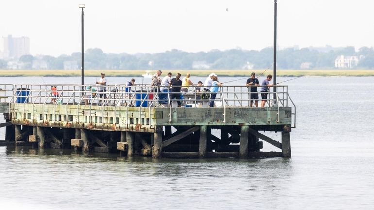 People taking advantage of this comfortable day while fishing off...