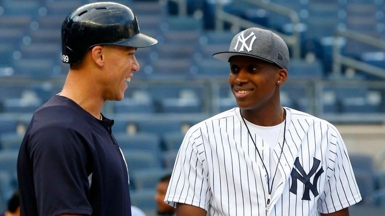 Knicks draft pick Frank Ntilikina talks with Aaron Judge of...