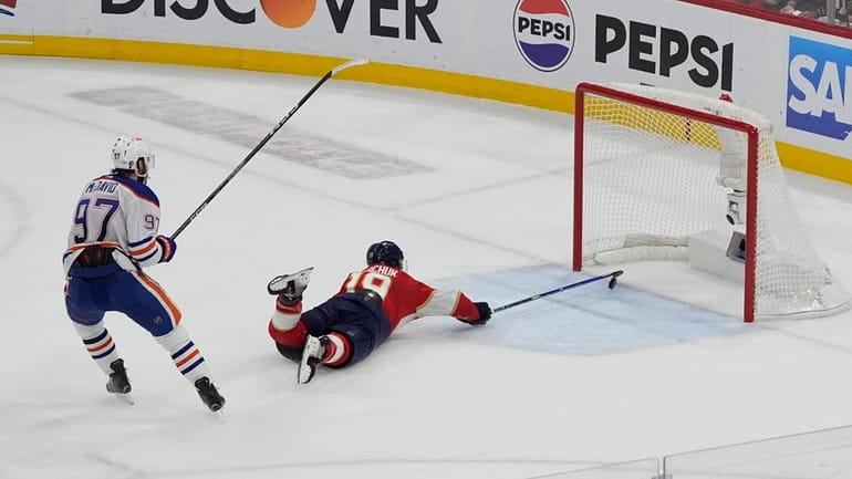 Florida Panthers left wing Matthew Tkachuk (19) attempts to stop...
