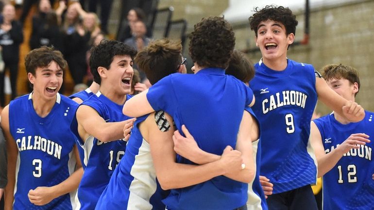 Calhoun teammates celebrate after their 3-2 win over Jericho in...