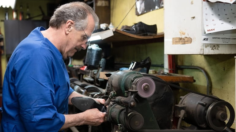 Fred Ruvolo, owner of Village Cobbler Shoppe in Riverhead, is...