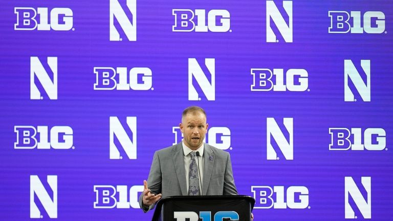 Northwestern head coach David Braun speaks during an NCAA college...