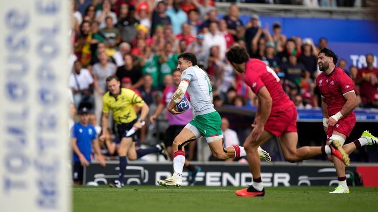 Portugal's Raffaele Storti runs with the ball before scoring a...