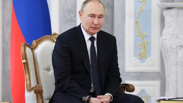 Russian President Vladimir Putin attends a meeting with Belarusian President...