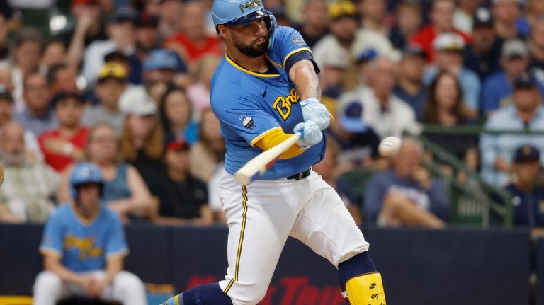 Milwaukee Brewers' Gary Sanchez hits a run-scoring double against the...