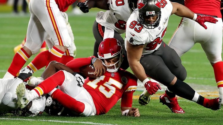 Kansas City quarterback Patrick Mahomes (15) is sacked by the...